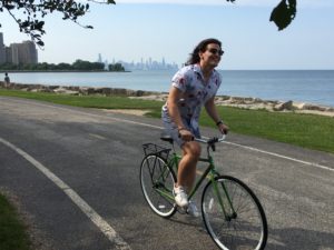 Young man biking at Promontory Point enjoying things to do in Hyde Park Chicago