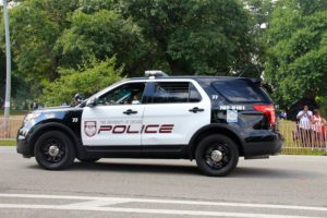 University of Chicago police car driving through Jackson Park
