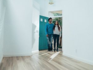 couple walks into empty apartment tour while moving to hyde park chicago