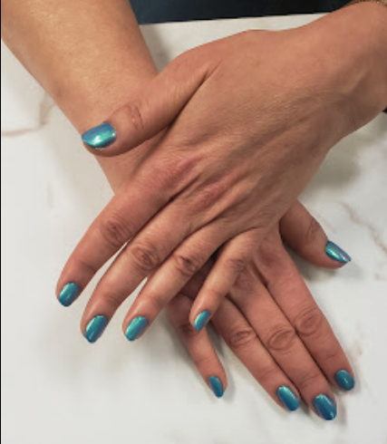 nails showing a blue manicure; nail salon hyde park chicago